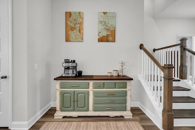 stairs with baseboards and wood finished floors