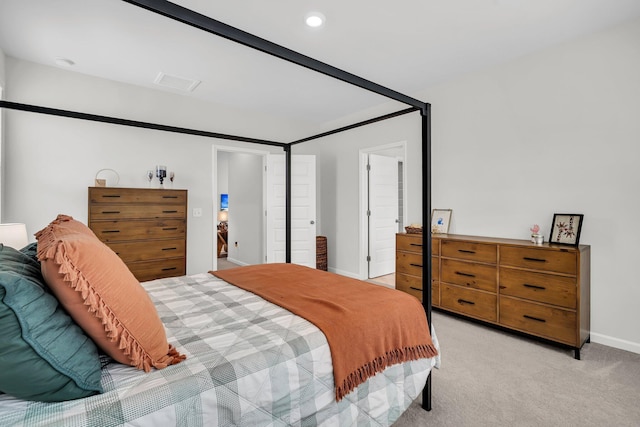 bedroom with baseboards, light carpet, recessed lighting, and visible vents