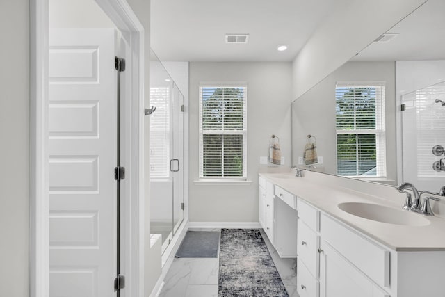 bathroom featuring a sink, visible vents, a shower stall, and marble finish floor