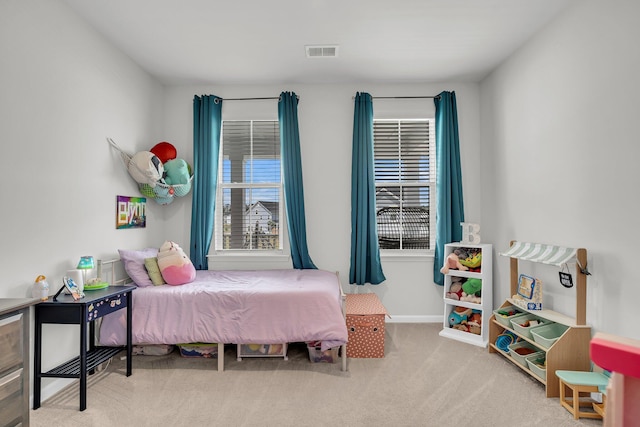 bedroom featuring visible vents, baseboards, and carpet floors