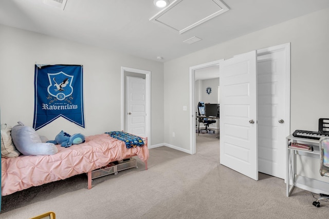 bedroom featuring carpet floors, baseboards, attic access, and visible vents