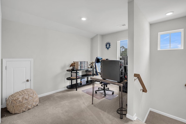 carpeted home office with baseboards and visible vents