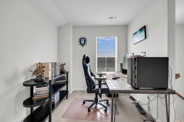 office featuring visible vents, carpet flooring, and baseboards