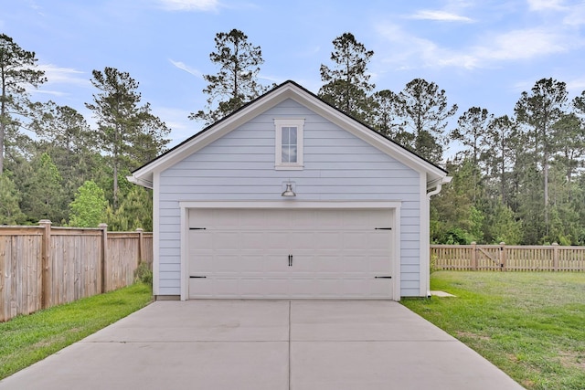 detached garage featuring fence
