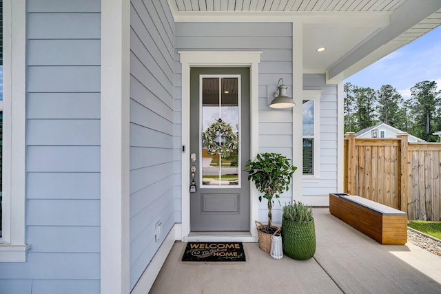 doorway to property with fence