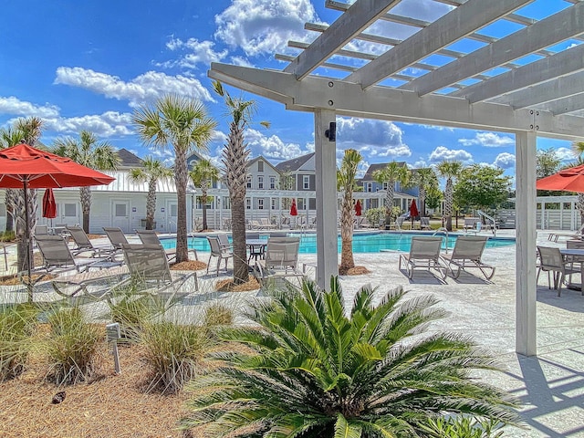 community pool featuring a pergola