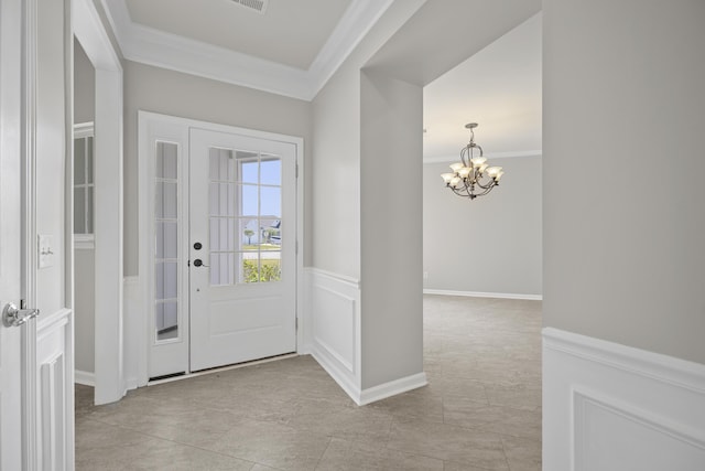 554 Tranquil Waters Way, Summerville, SC 29486 - foyer entrance featuring crown molding, light tile patterned flooring, a wainscoted wall, a notable chandelier, and visible vents