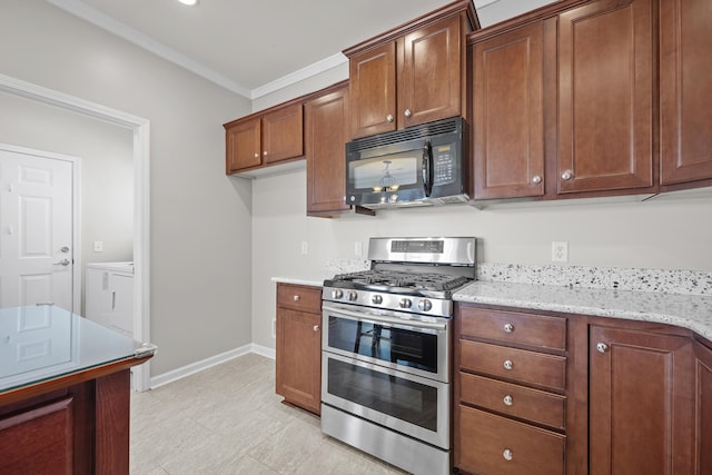 554 Tranquil Waters Way, Summerville, SC 29486 - kitchen featuring double oven range, baseboards, light stone counters, crown molding, and black microwave
