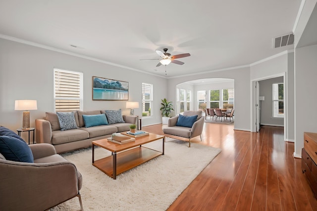 554 Tranquil Waters Way, Summerville, SC 29486 - living room featuring ceiling fan, arched walkways, ornamental molding, and visible vents