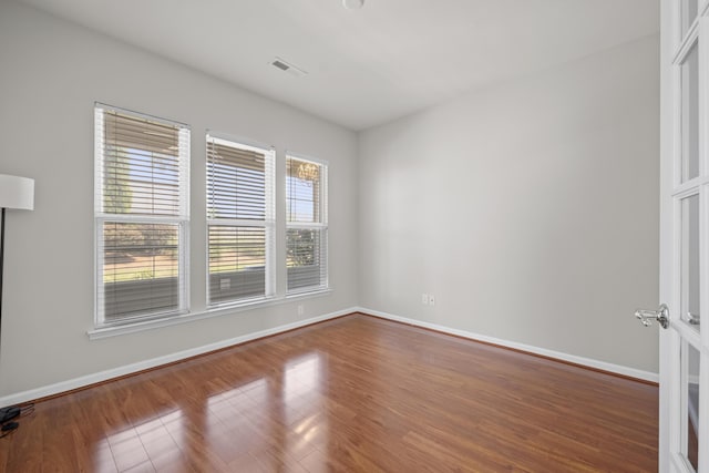 554 Tranquil Waters Way, Summerville, SC 29486 - empty room with baseboards, wood finished floors, and visible vents