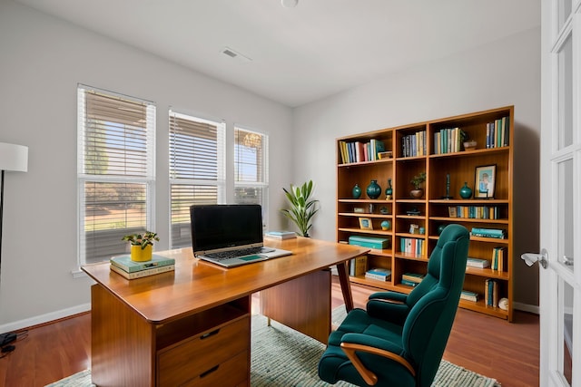 554 Tranquil Waters Way, Summerville, SC 29486 - office area featuring baseboards, wood finished floors, and visible vents