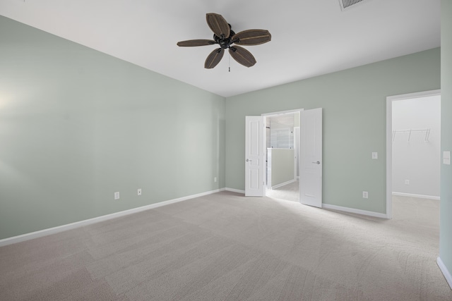 554 Tranquil Waters Way, Summerville, SC 29486 - unfurnished bedroom featuring baseboards, a spacious closet, a ceiling fan, a closet, and carpet floors