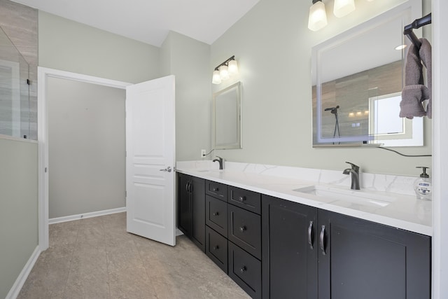 554 Tranquil Waters Way, Summerville, SC 29486 - bathroom featuring baseboards, double vanity, tiled shower, and a sink