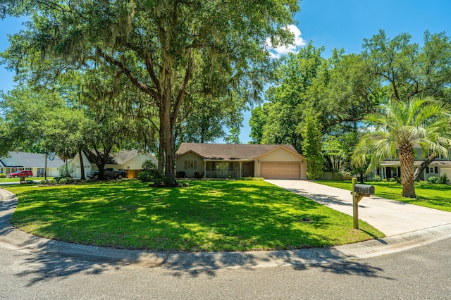 view of front of house featuring a front yard and a garage