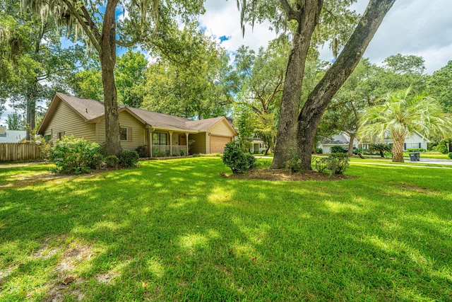 view of yard featuring a garage