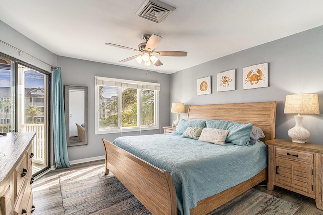 9000 Palmetto Dr Unit 202-C, Isle Of Palms, SC 29451 - bedroom with visible vents, baseboards, ceiling fan, wood finished floors, and access to exterior