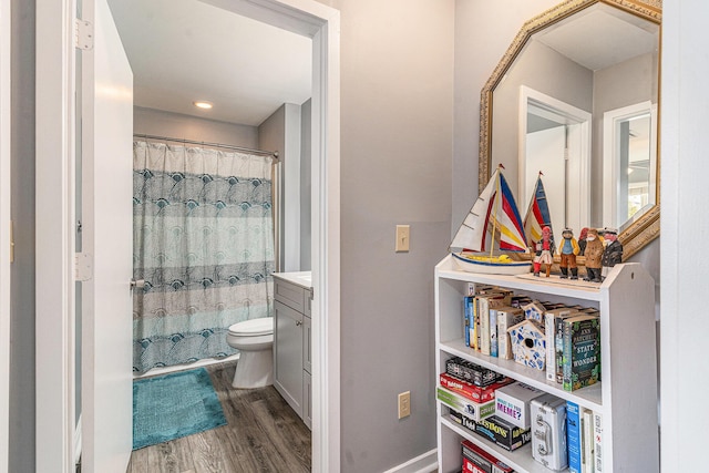 9000 Palmetto Dr Unit 202-C, Isle Of Palms, SC 29451 - bathroom featuring curtained shower, vanity, toilet, and wood finished floors