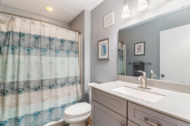 9000 Palmetto Dr Unit 202-C, Isle Of Palms, SC 29451 - full bathroom with visible vents, toilet, vanity, and a shower with curtain