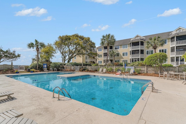 9000 Palmetto Dr Unit 202-C, Isle Of Palms, SC 29451 - community pool featuring a patio area and fence