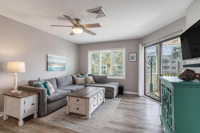 9000 Palmetto Dr Unit 202-C, Isle Of Palms, SC 29451 - living room with light wood-style flooring, baseboards, a ceiling fan, and visible vents