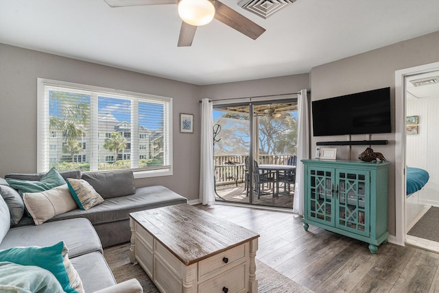 9000 Palmetto Dr Unit 202-C, Isle Of Palms, SC 29451 - living area with visible vents, baseboards, a ceiling fan, and wood finished floors