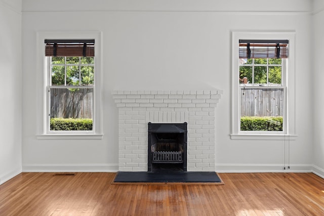 9 Wesley Dr, Charleston, SC 29407 - detailed view of wood finished floors, baseboards, and a fireplace