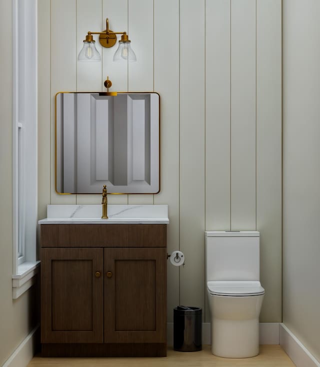 5209 Seewee Rd, Awendaw, SC 29429 - half bathroom with vanity, toilet, and baseboards