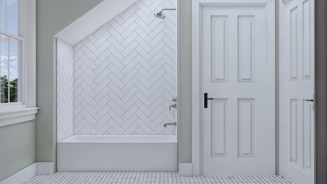 bathroom with tile patterned floors and tiled shower / bath combo