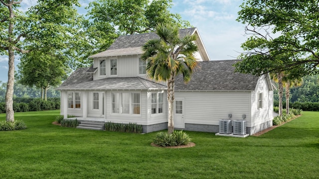 back of property featuring a lawn and cooling unit