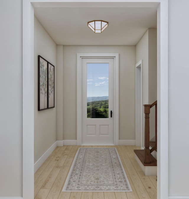 doorway to outside with light hardwood / wood-style flooring