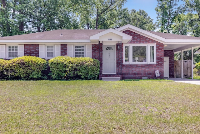 1821 Wasp St, North Charleston, SC 29405 - ranch-style home featuring a carport, brick siding, and a front yard