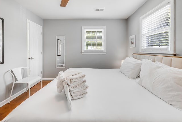 1821 Wasp St, North Charleston, SC 29405 - bedroom featuring visible vents, wood finished floors, baseboards, and ceiling fan