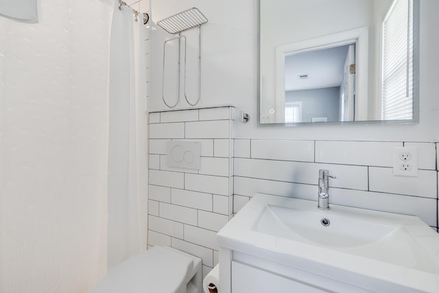 1821 Wasp St, North Charleston, SC 29405 - bathroom with toilet, tile walls, vanity, and curtained shower