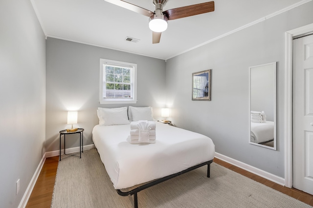 1821 Wasp St, North Charleston, SC 29405 - bedroom with baseboards, visible vents, crown molding, and wood finished floors