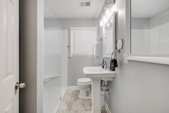 1821 Wasp St, North Charleston, SC 29405 - bathroom with walk in shower, toilet, baseboards, and visible vents
