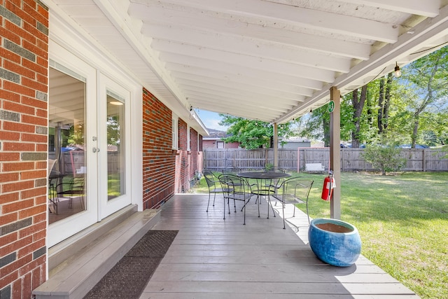 1821 Wasp St, North Charleston, SC 29405 - deck with a fenced backyard, a yard, french doors, and outdoor dining space