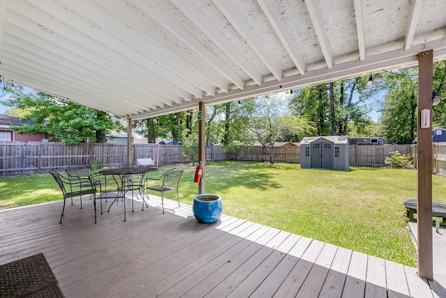 1821 Wasp St, North Charleston, SC 29405 - wooden deck featuring a yard, outdoor dining space, a fenced backyard, and a storage unit