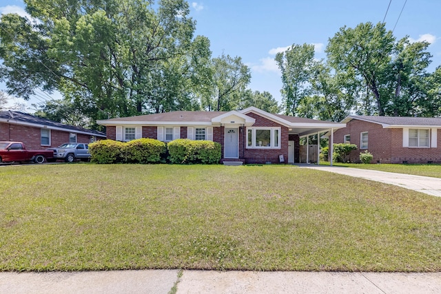 1821 Wasp St, North Charleston, SC 29405 - single story home featuring a front yard, an attached carport, brick siding, and driveway