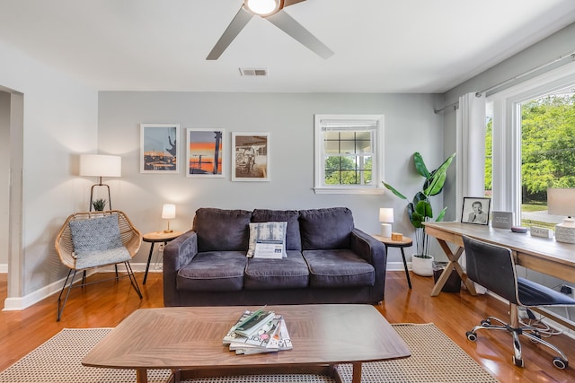 1821 Wasp St, North Charleston, SC 29405 - living area featuring baseboards, a healthy amount of sunlight, visible vents, and wood finished floors