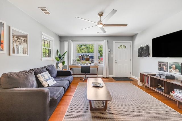 1821 Wasp St, North Charleston, SC 29405 - living area featuring ceiling fan, baseboards, visible vents, and wood finished floors