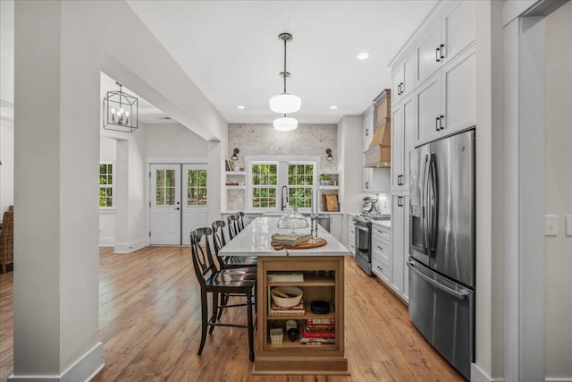 kitchen with stainless steel appliances, open shelves, plenty of natural light, and recessed lighting