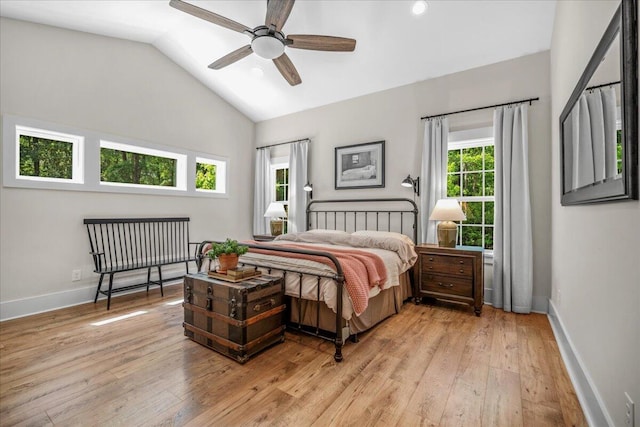 bedroom with light wood-type flooring, lofted ceiling, baseboards, recessed lighting, and a ceiling fan