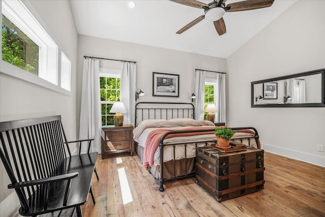 bedroom with lofted ceiling, hardwood / wood-style flooring, baseboards, a ceiling fan, and recessed lighting