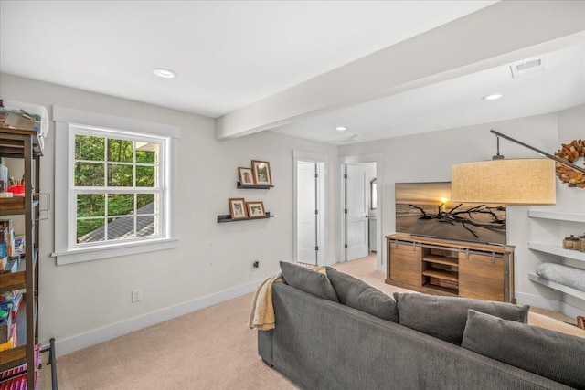living room with light colored carpet, baseboards, and recessed lighting