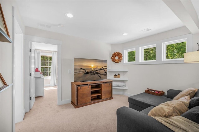living room with light colored carpet, recessed lighting, and baseboards