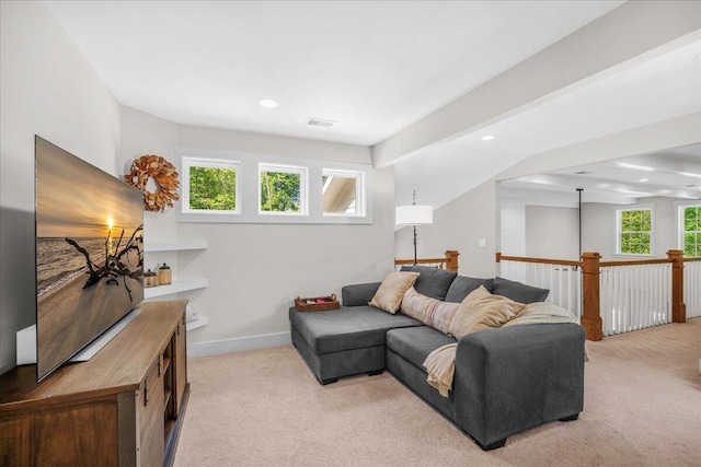 living area with light carpet, healthy amount of natural light, recessed lighting, and baseboards