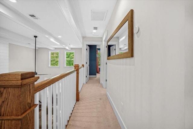 hall featuring light carpet, baseboards, and recessed lighting