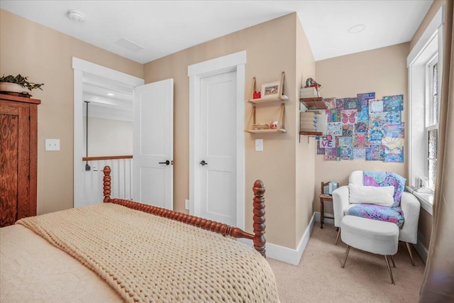 bedroom featuring carpet floors and baseboards