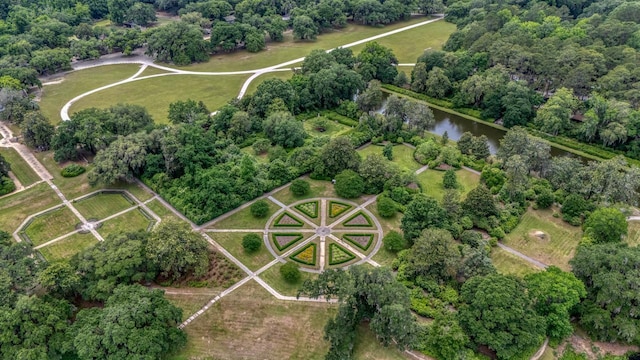 aerial view of property's location featuring a tree filled landscape