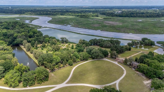 aerial view of property and surrounding area with a nearby body of water